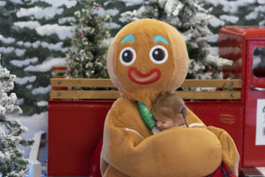 Gingerbread Man Hugging Small Female Child