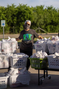 Junior League of Austin Member Volunteers at a FIT Summer Distribution Day