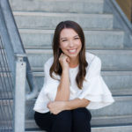 Photo of Krystin Gresham sitting on the steps at JLA