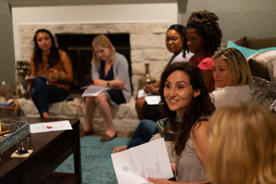 JLA members converse at a small group meeting